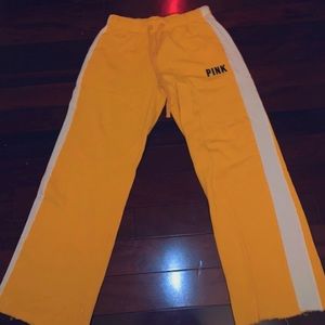 PINK yellow sweatpants.